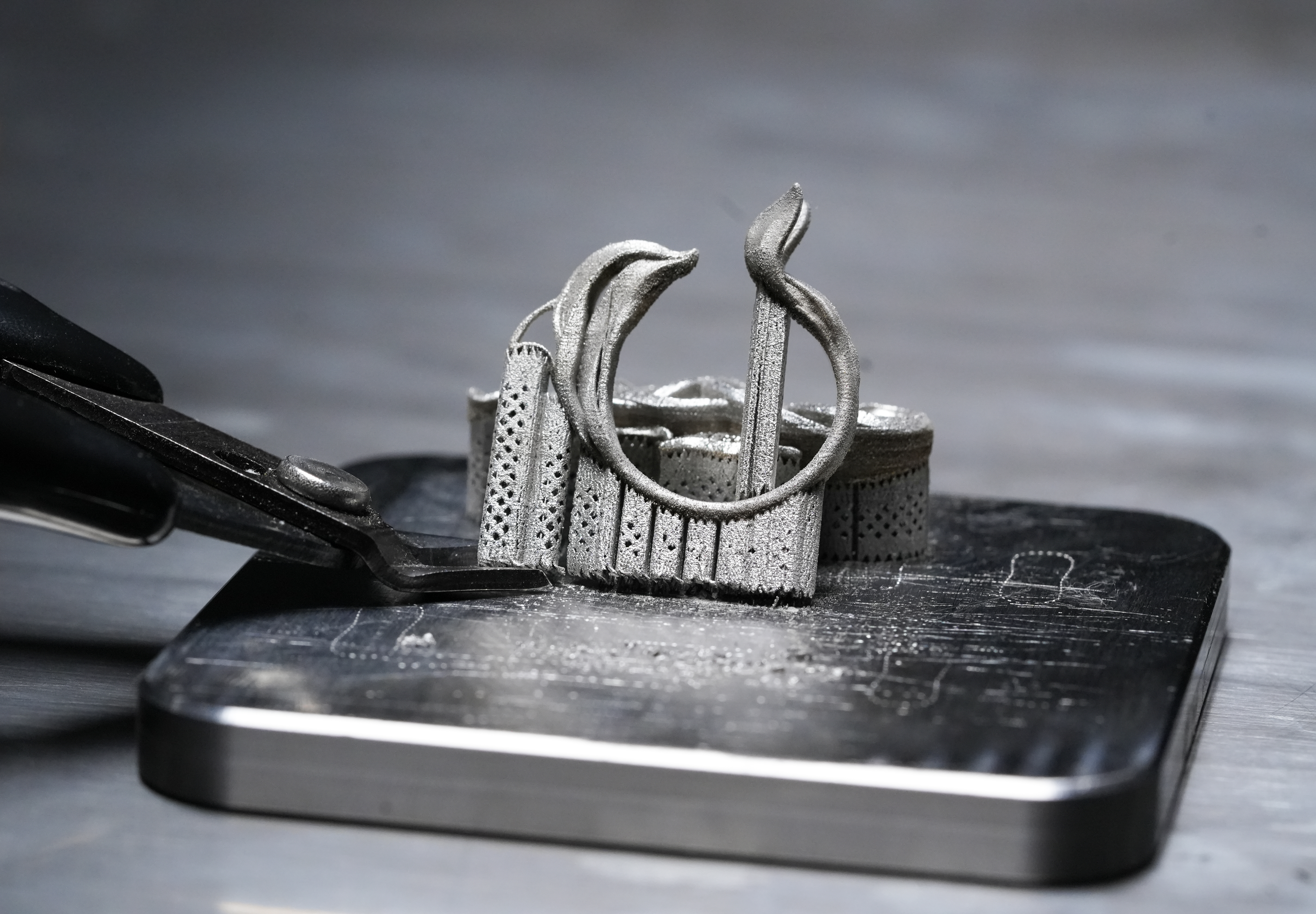 Wire cutters used to remove the supports of a SnowPod metal print